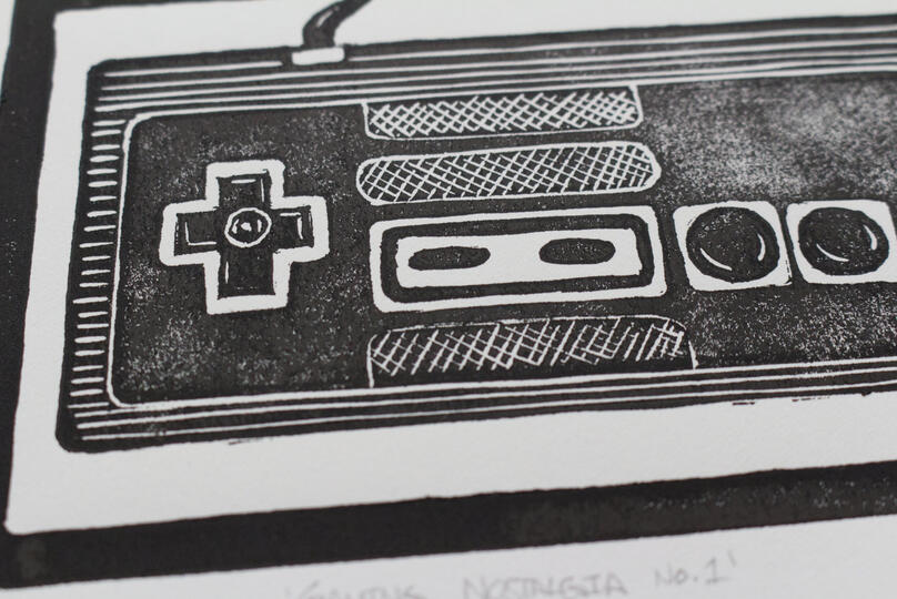 A blockprint of a retro NES controller.