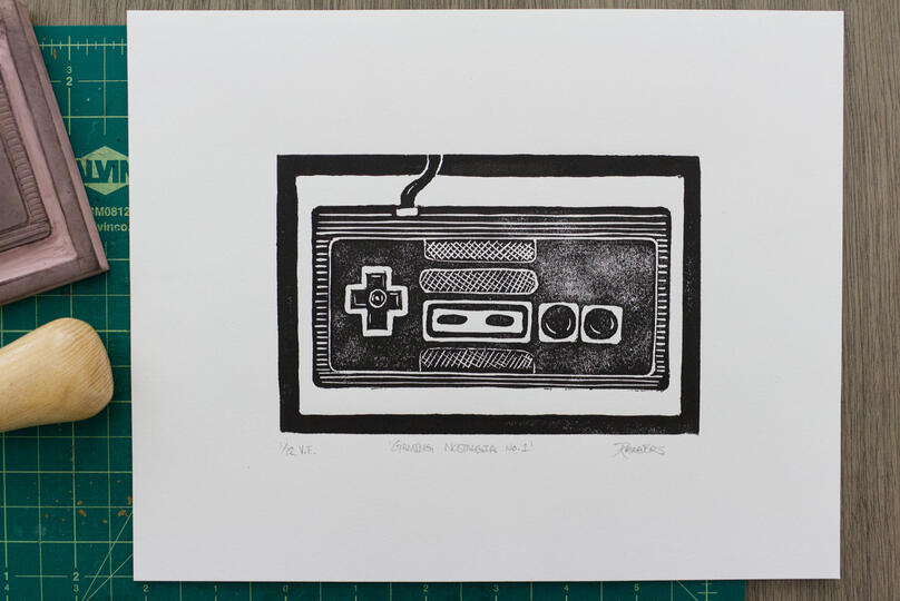 A blockprint of a retro NES controller.