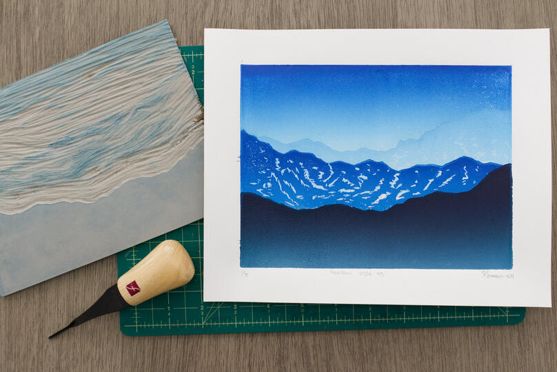 A 4-step reduction blockprint of a mountain vista.