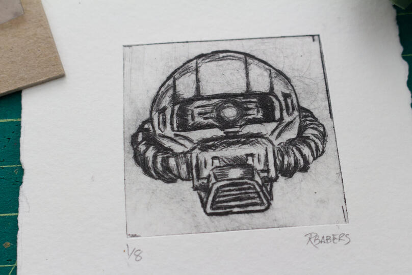 Drypoint etching print of a Zaku head.