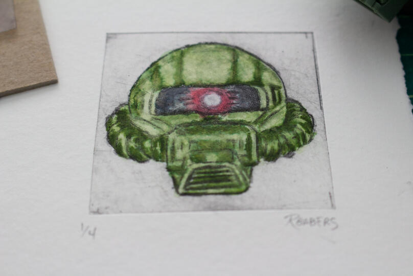 Drypoint etching and watercolor print of a Zaku head.