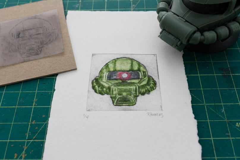 Drypoint etching and watercolor print of a Zaku head.