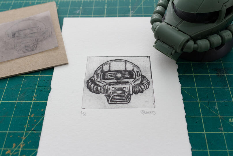 Drypoint etching print of a Zaku head.