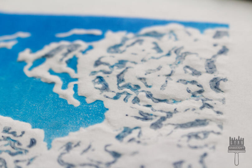 4x3" Blockprint of a blue sky and clouds with dry embossing.