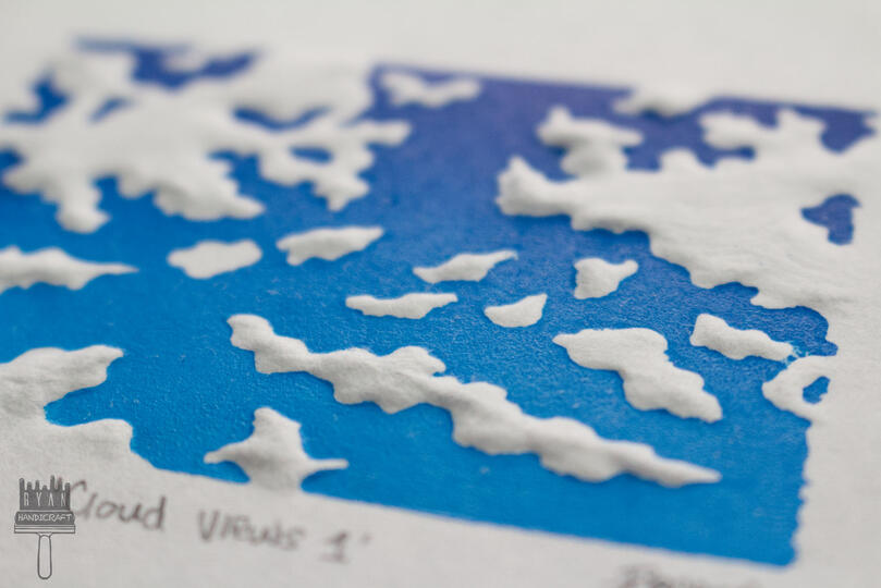 2x3" Blockprint of a blue sky and clouds with dry embossing.
