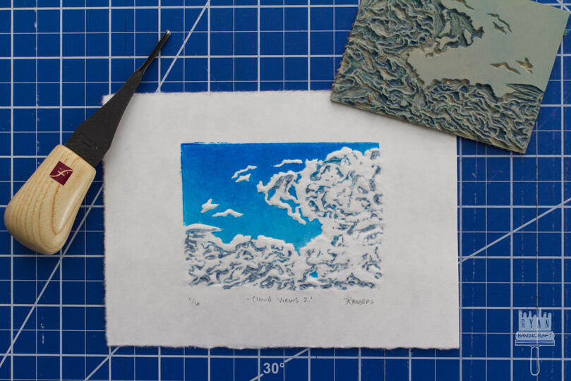 4x3" Blockprint of a blue sky and clouds with dry embossing.
